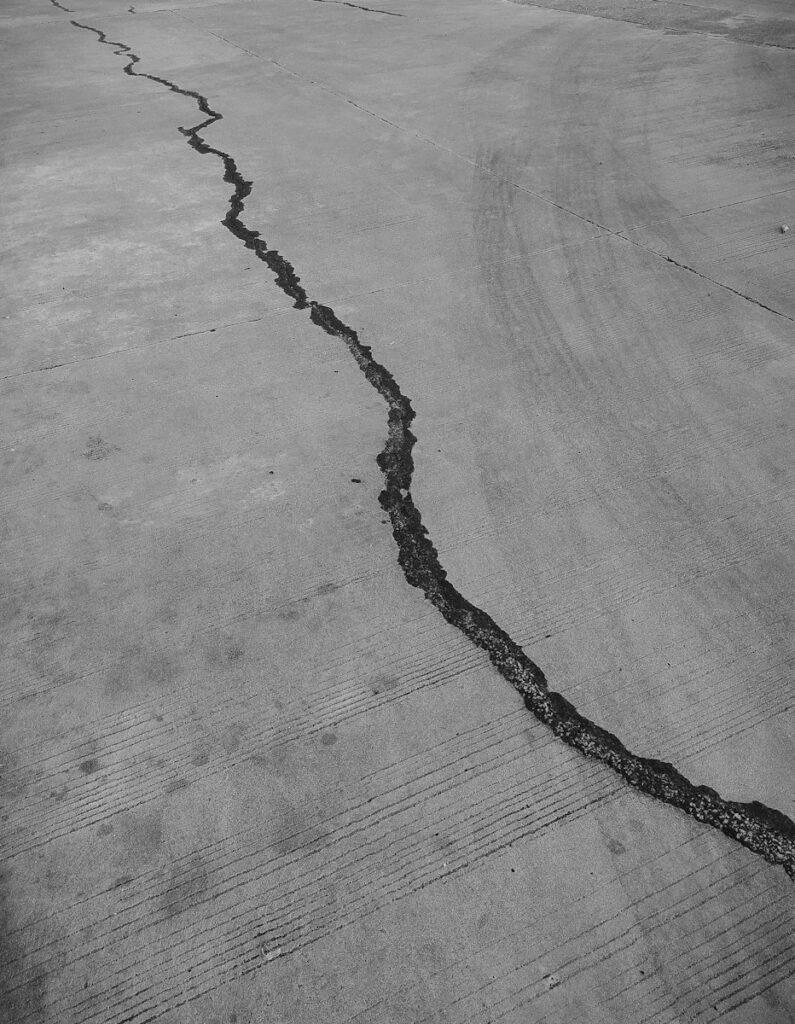 grayscale photo of a wooden floor