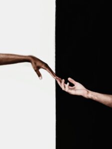 persons feet on white wall