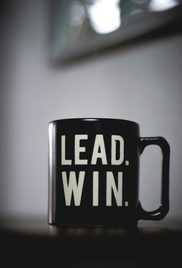 The Future of Intentional Leadership with Greg Smith 2 a black coffee mug with the words lead win printed on it