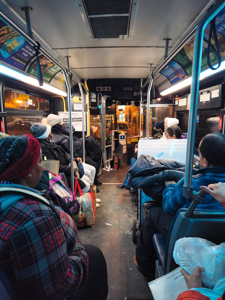 A group of people sitting on a bus next to each other