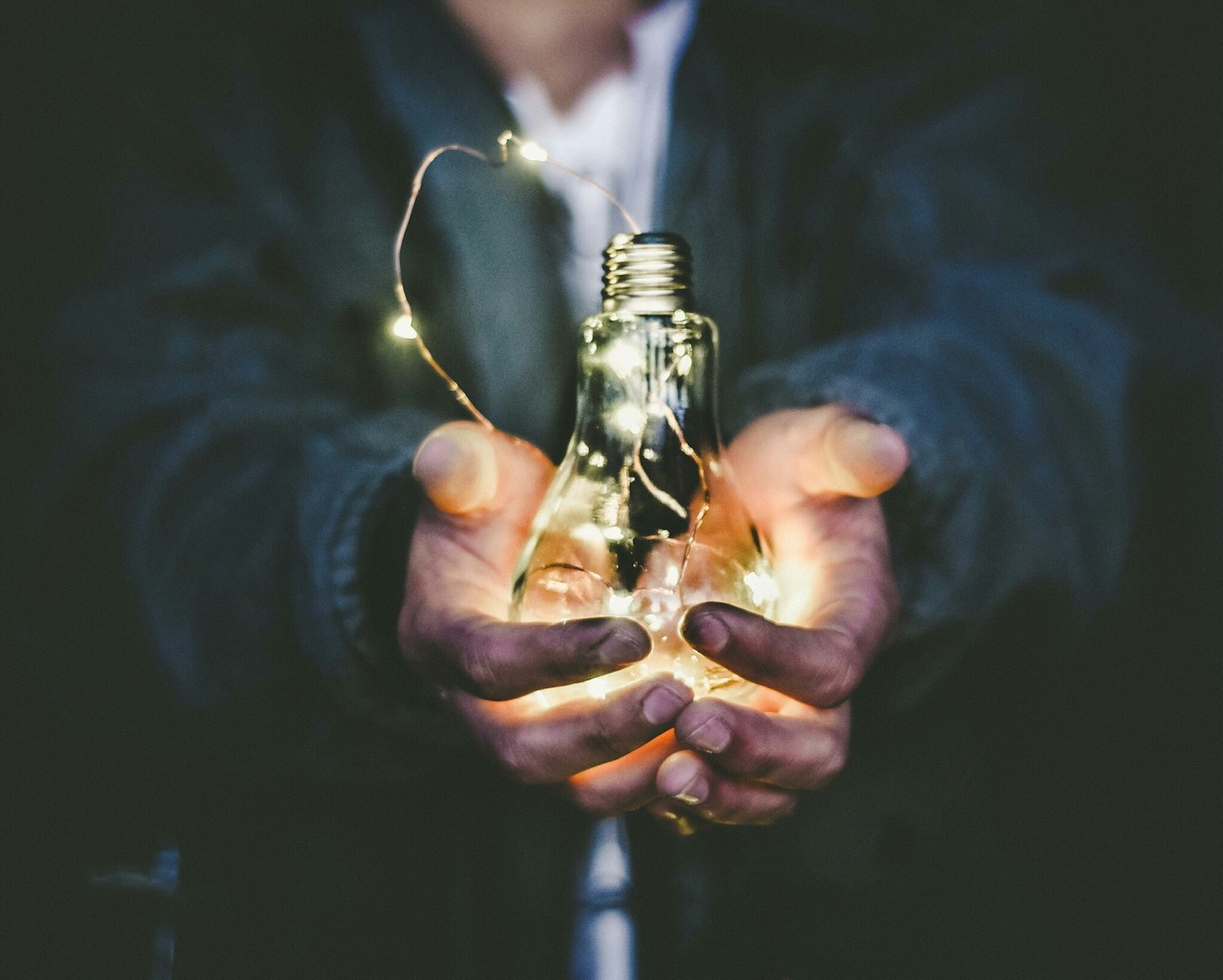 Finding Passion at Work: Why Coaching Shouldn’t Wear Off 1 man holding incandescent bulb
