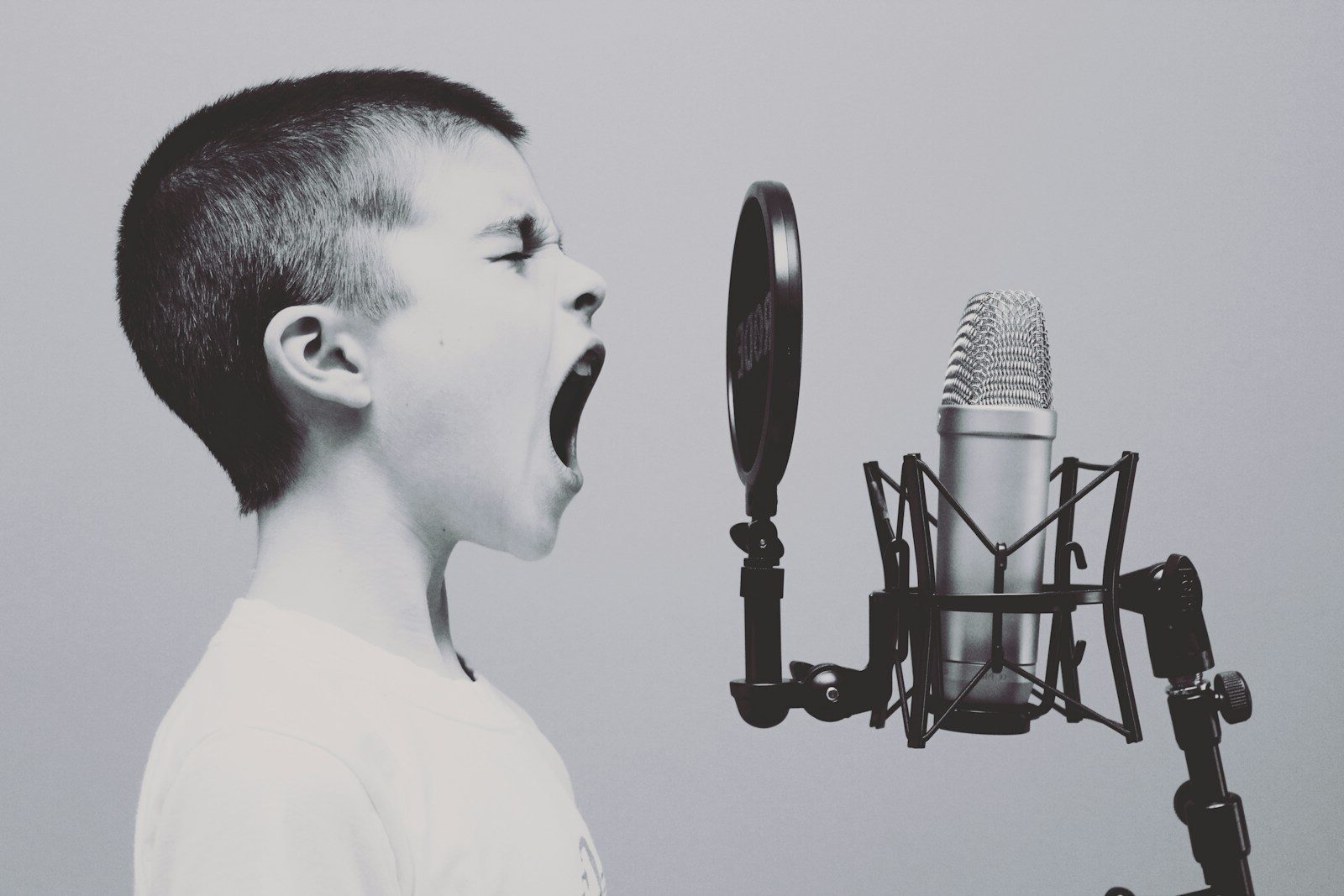 The Moments That Matter: Why Leadership Is Built in the Smallest Interactions 1 boy singing on microphone with pop filter