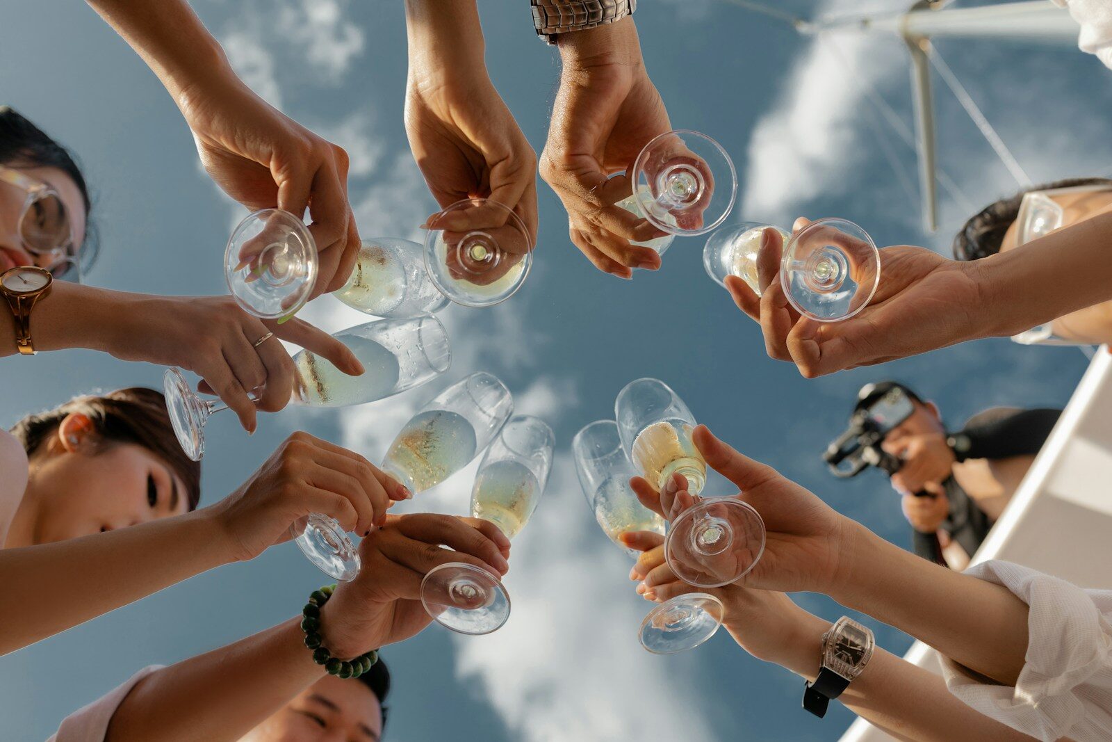 Why Great Leaders Stop to Celebrate 1 people holding clear glass bottles during daytime