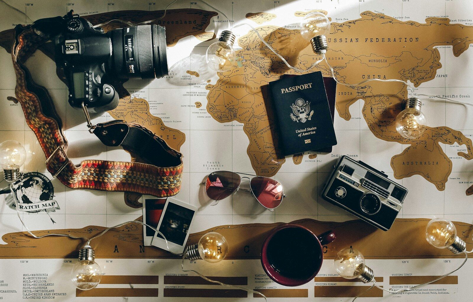 Travel as a Force for Good: Curiosity, Trust, and the Courage to Leave the Nest 1 black DSLR camera near passport